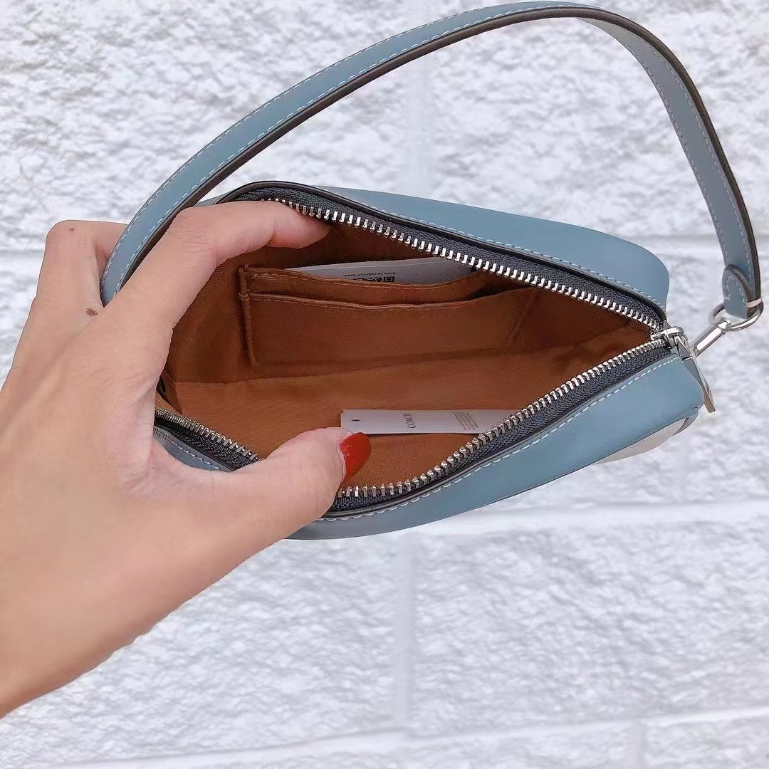 Coach CB851 Jamie Wristlet In Signature Canvas With Varsity Motif In SV/Chalk/Indigo Coach CB851 Jamie Wristlet In Signature Canvas With Varsity Motif In SV/Chalk/Indigo